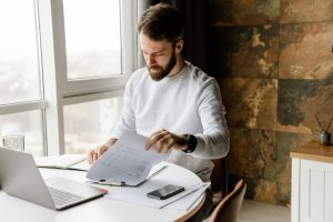 Man looking through papers