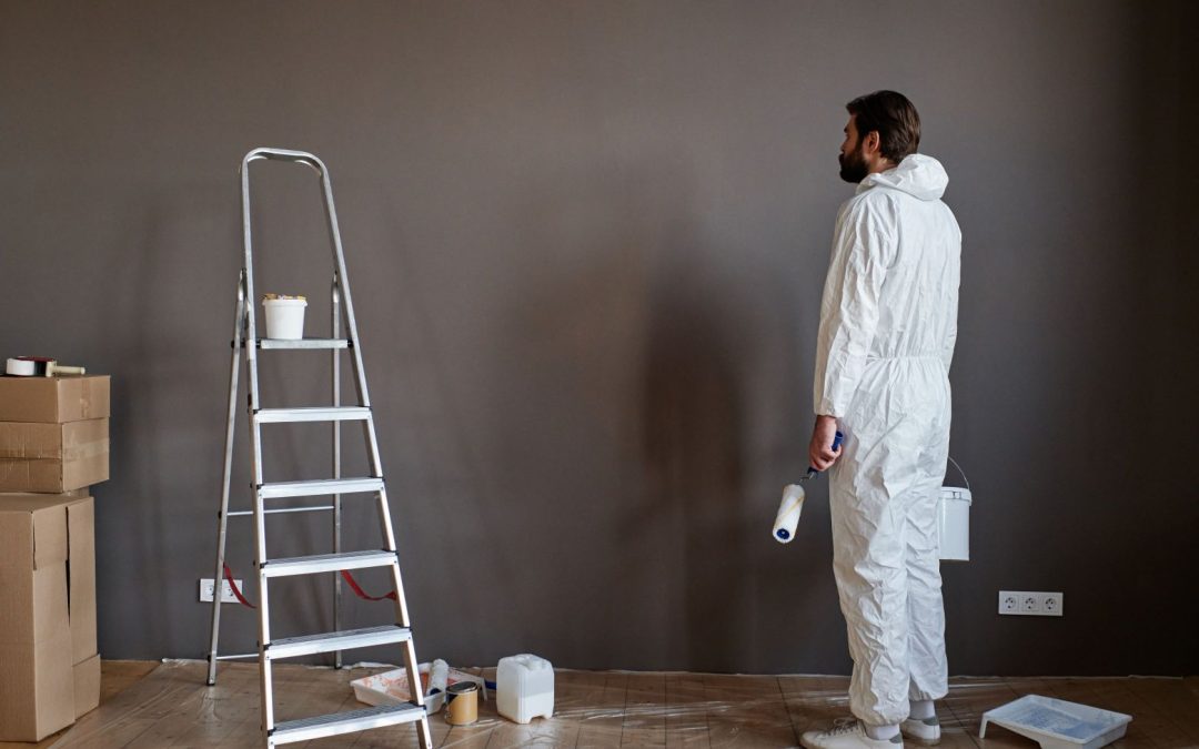 Man painting his wall