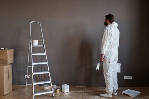 Man painting his wall