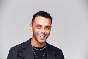 Young man wearing hoops earings